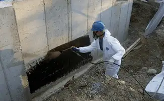 Professional waterproofing the exterior walls of the basement in Duluth, MN