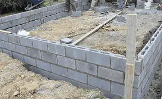 Professionals building a foundation with blocks in Duluth, MN