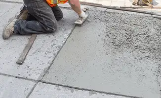 Professional repairing a concrete floor in Duluth, MN