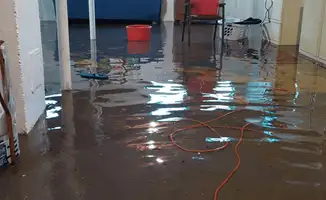 Basement with boiler, cabinets and washing machine completely flooded in Duluth, MN